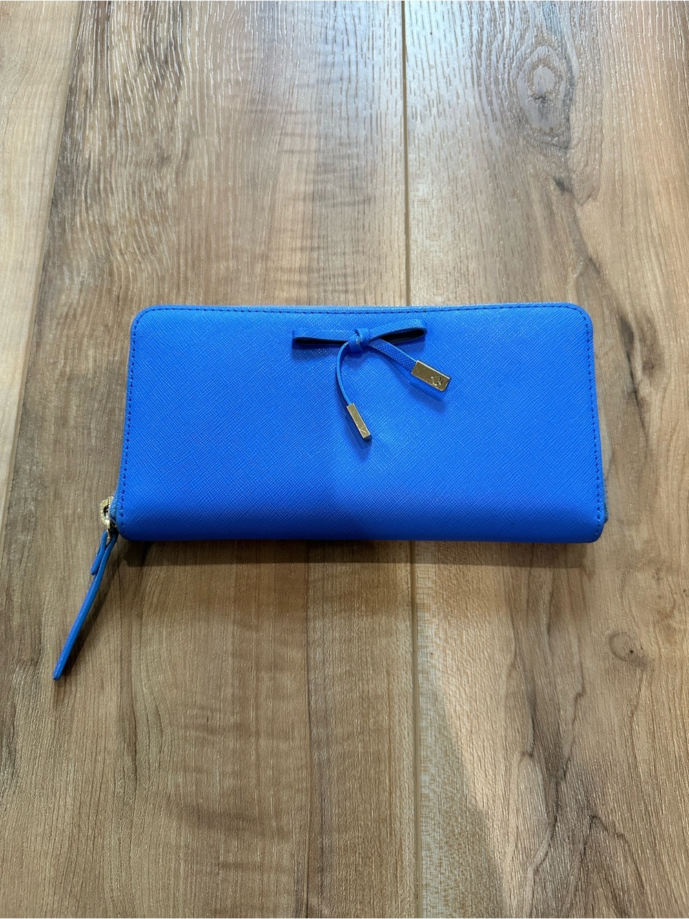 Kate Spade New York saffiano leather wallet vibrant blue bow embellishment